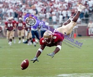 Florida State's Peter Warrick dives for the ball during a game at Doak Campbell Stadium in Tallahassee, FL.